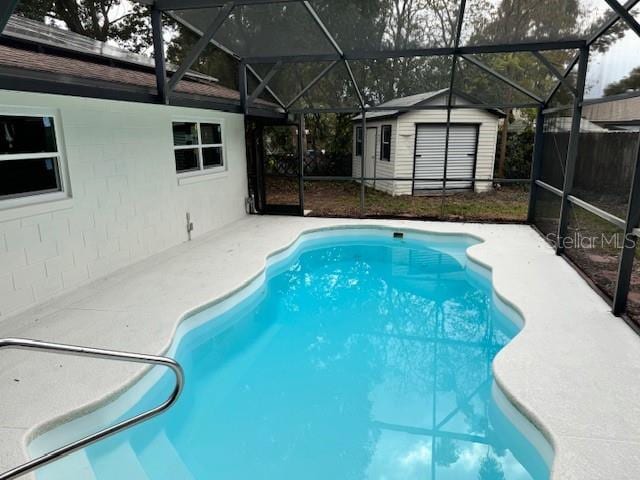 view of pool with a shed