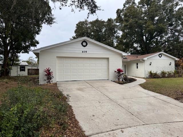 single story home featuring a garage