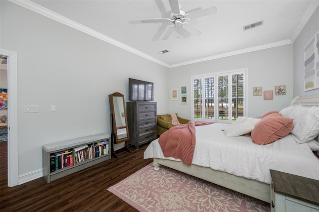 bedroom featuring ceiling fan, ornamental molding, and dark wood-type flooring