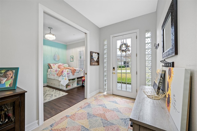 entrance foyer featuring a healthy amount of sunlight and light tile patterned floors