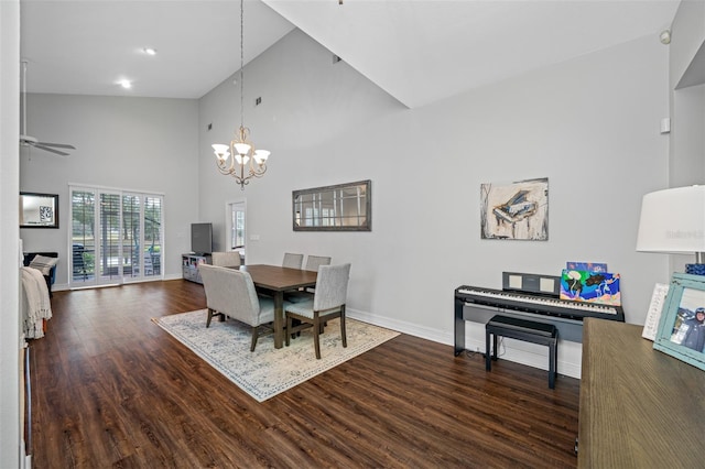 dining space featuring high vaulted ceiling, dark hardwood / wood-style flooring, and ceiling fan with notable chandelier