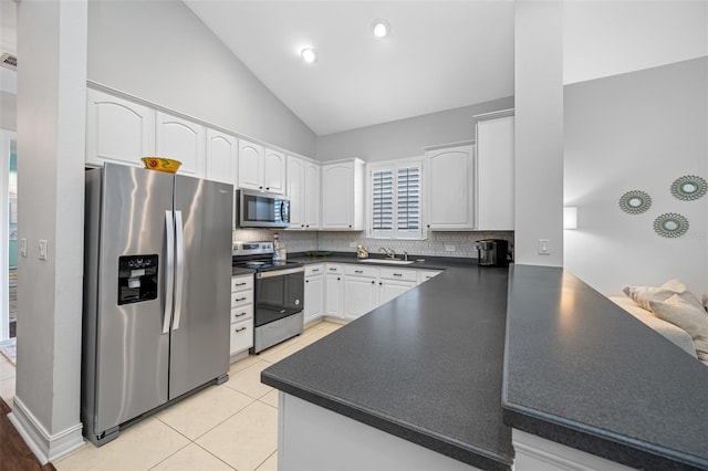 kitchen featuring sink, kitchen peninsula, white cabinets, and stainless steel appliances