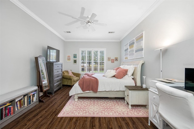 bedroom featuring dark hardwood / wood-style flooring, ceiling fan, and ornamental molding