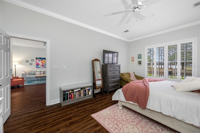 bedroom featuring dark hardwood / wood-style floors, ceiling fan, and ornamental molding