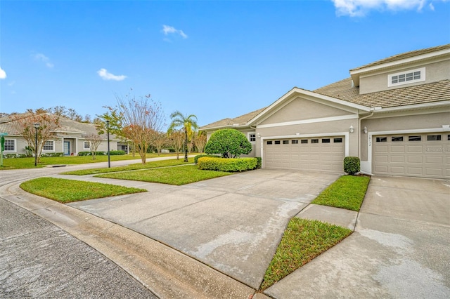 view of front of home with a garage and a front yard