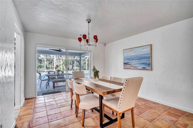 dining area featuring an inviting chandelier