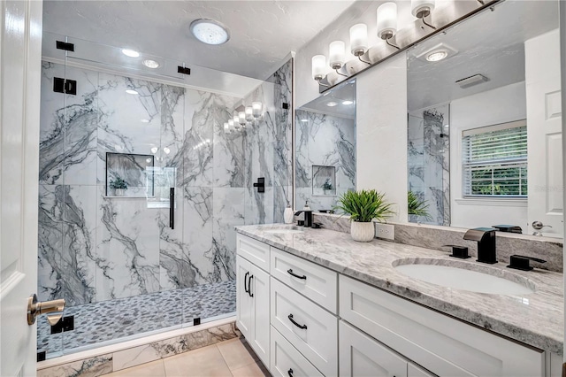 bathroom with walk in shower and vanity