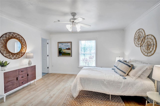 bedroom with crown molding, ceiling fan, and light hardwood / wood-style floors