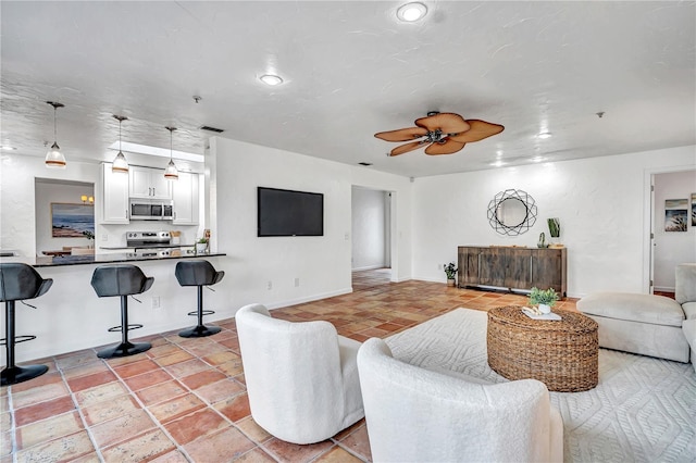 living room featuring ceiling fan