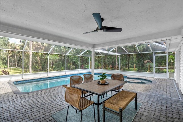 11624 Monette Rd, Riverview, FL 33569 - outdoor pool with an in-ground hot tub, a patio area, glass enclosure, and a ceiling fan
