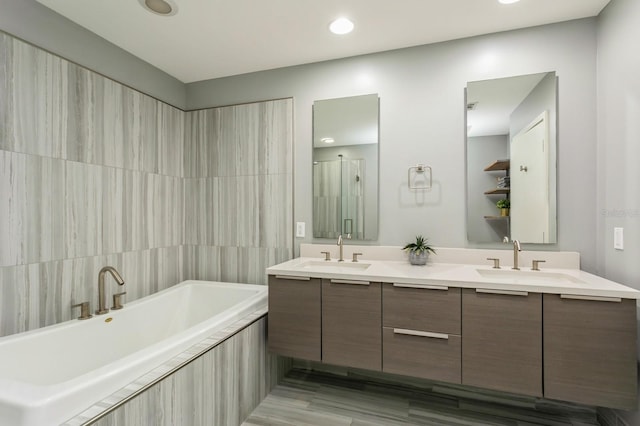 bathroom featuring vanity and plus walk in shower