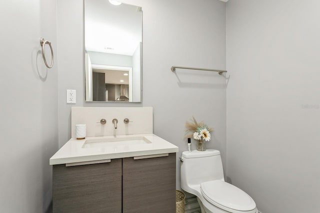 bathroom with vanity and toilet