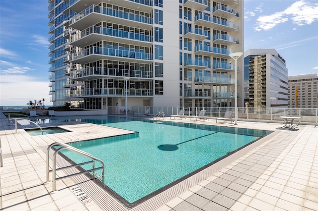 view of swimming pool with a patio