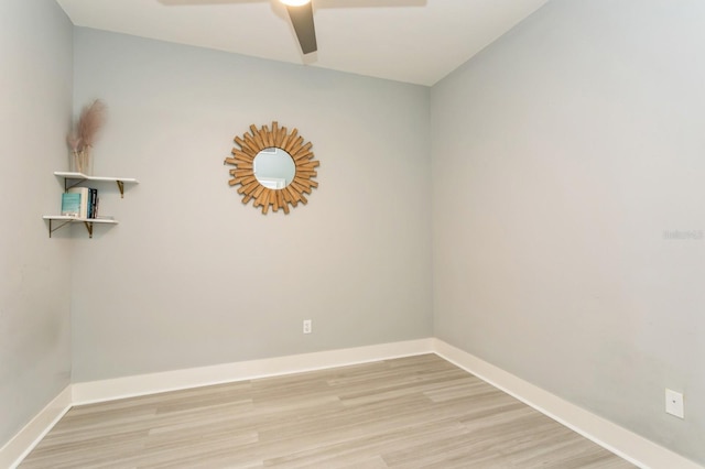 empty room with ceiling fan and light hardwood / wood-style floors