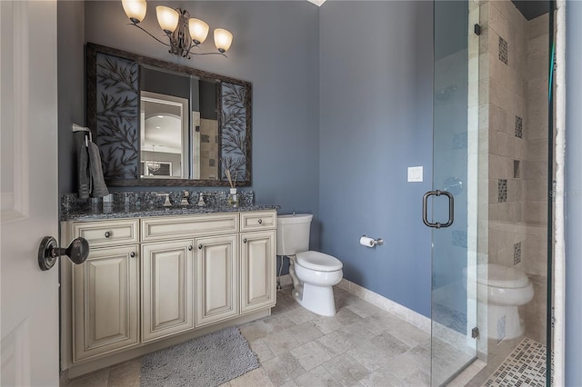 bathroom with vanity, toilet, walk in shower, and a notable chandelier