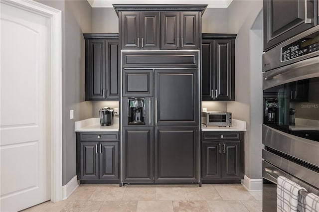 kitchen with ornamental molding and stainless steel double oven