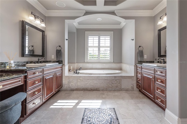 bathroom featuring vanity, ornamental molding, and a relaxing tiled tub