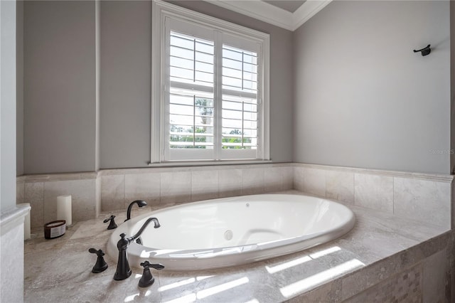 bathroom with crown molding and tiled bath