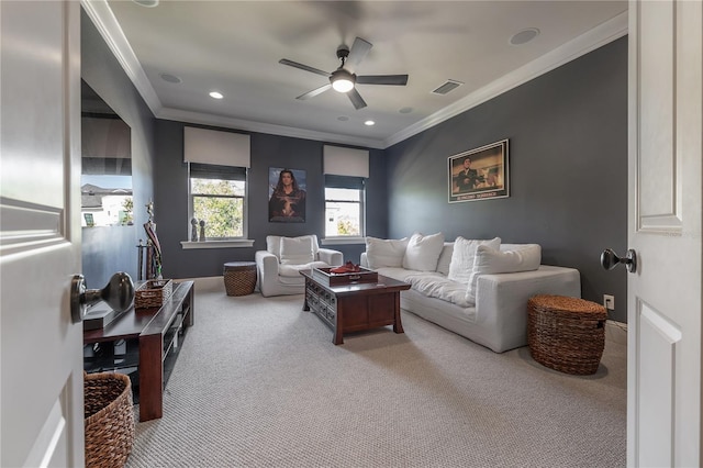 carpeted living room featuring ceiling fan and ornamental molding