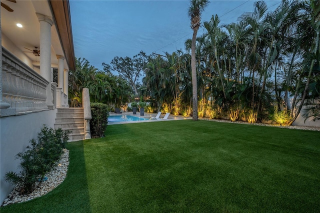 view of yard featuring ceiling fan