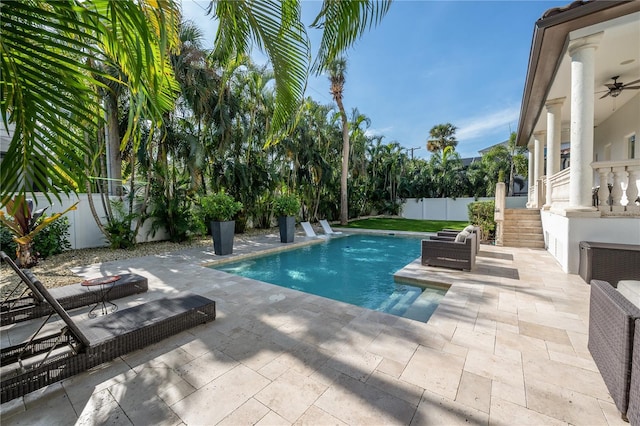 view of pool featuring a patio area and ceiling fan