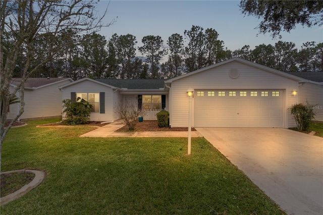 single story home featuring a yard, a garage, and covered porch