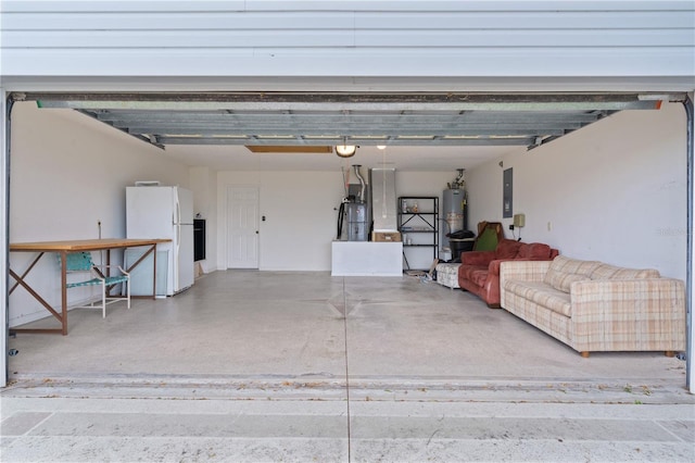 garage with water heater, white fridge, electric panel, and strapped water heater