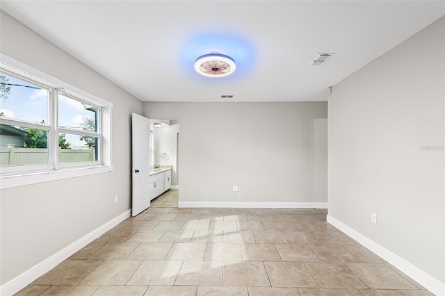 unfurnished bedroom featuring light tile patterned flooring