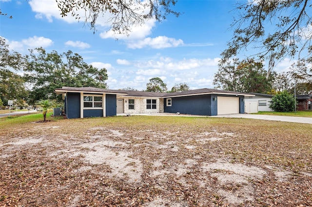 single story home featuring a garage