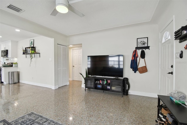 living room with ceiling fan