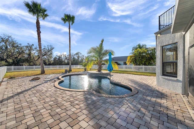 view of pool with a fenced in pool, a patio area, and a fenced backyard