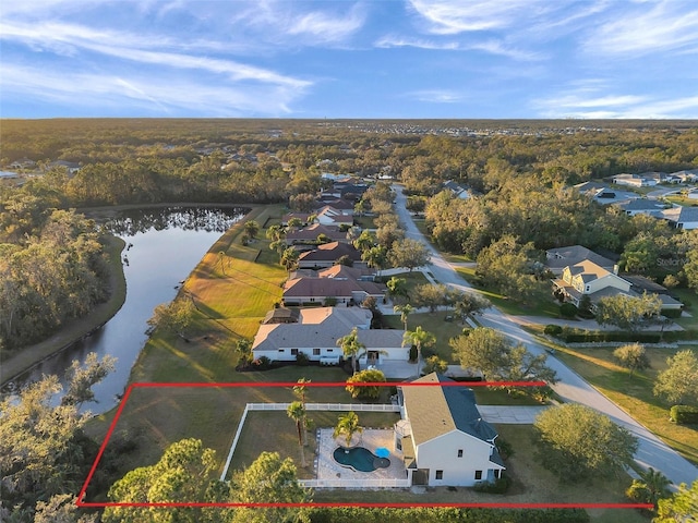 bird's eye view featuring a water view and a residential view