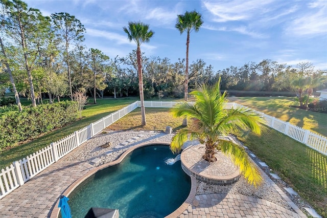 view of pool featuring a lawn, a fenced backyard, and a fenced in pool