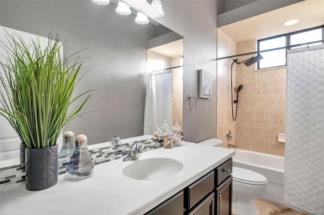 bathroom featuring toilet, backsplash, shower / bath combination with curtain, and vanity