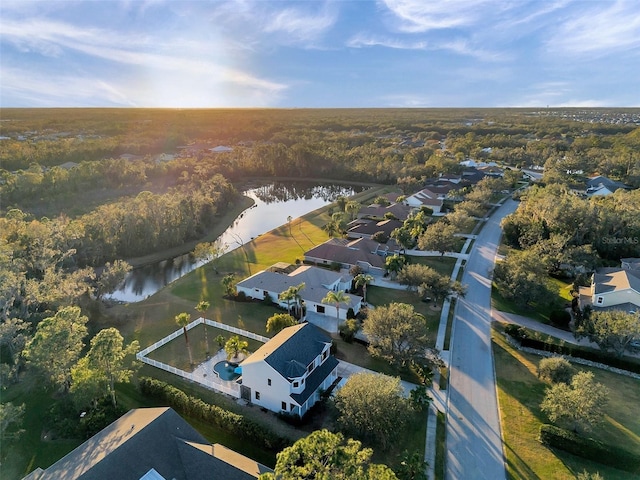 birds eye view of property with a water view and a residential view