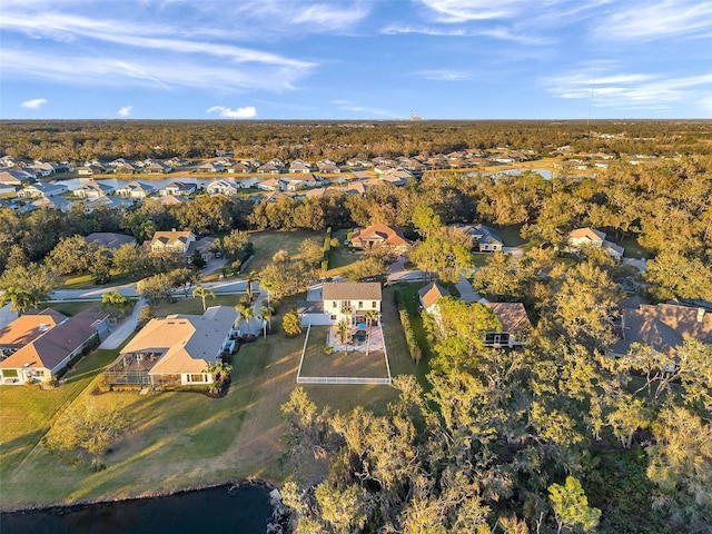 drone / aerial view with a residential view and a water view