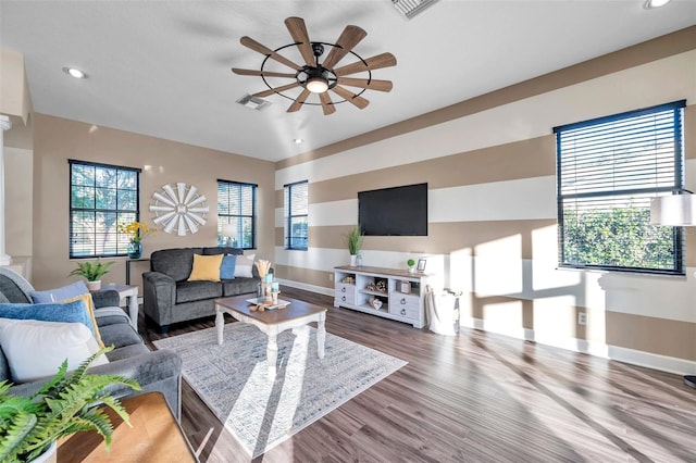 living room with a ceiling fan, visible vents, recessed lighting, wood finished floors, and baseboards