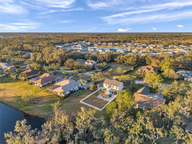 drone / aerial view with a water view and a residential view