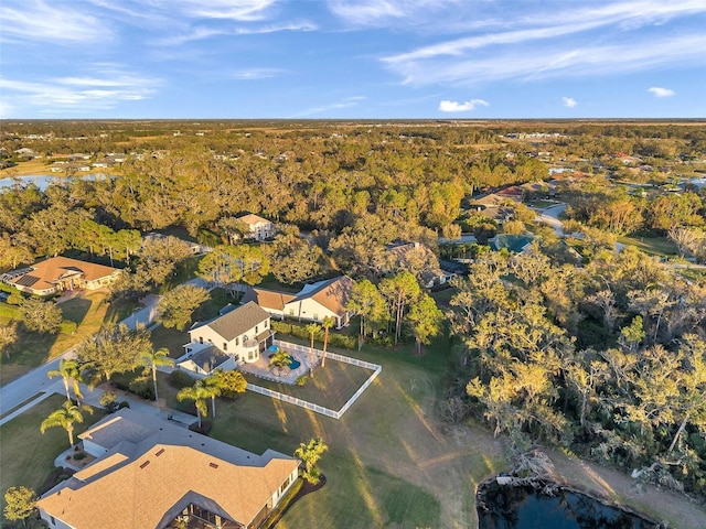 bird's eye view featuring a water view and a residential view