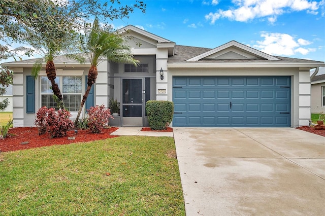 view of front of home featuring a garage and a front yard