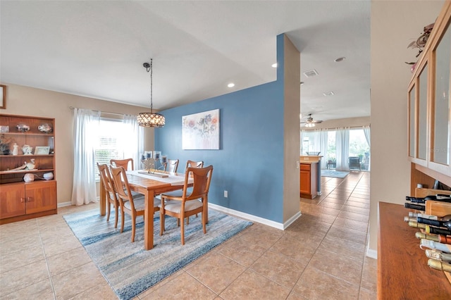 dining room with light tile patterned flooring and ceiling fan