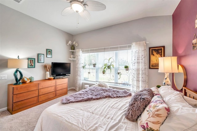 bedroom with lofted ceiling, ceiling fan, and carpet