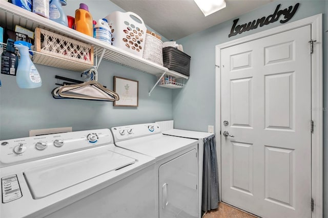 laundry area with separate washer and dryer