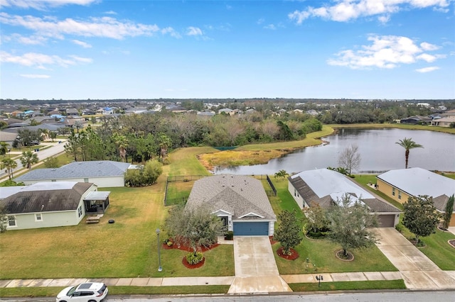 drone / aerial view with a water view