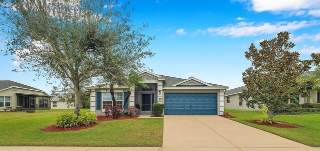 5720 107th Ter E, Parrish, FL 34219 - ranch-style house featuring a garage, concrete driveway, a front yard, and stucco siding