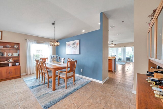 5720 107th Ter E, Parrish, FL 34219 - dining space with light tile patterned flooring, ceiling fan, recessed lighting, and a chandelier