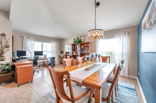 5720 107th Ter E, Parrish, FL 34219 - dining area featuring plenty of natural light, a desk, a chandelier, and light tile patterned floors