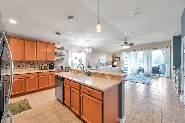5720 107th Ter E, Parrish, FL 34219 - kitchen featuring dishwasher, light countertops, freestanding refrigerator, open floor plan, and light tile patterned floors