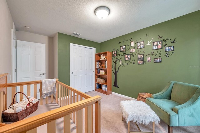 5720 107th Ter E, Parrish, FL 34219 - bedroom featuring light carpet, a textured ceiling, and a closet