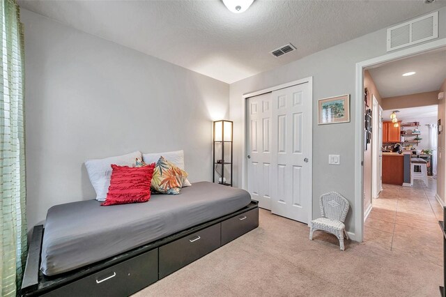 5720 107th Ter E, Parrish, FL 34219 - bedroom featuring light carpet and a closet